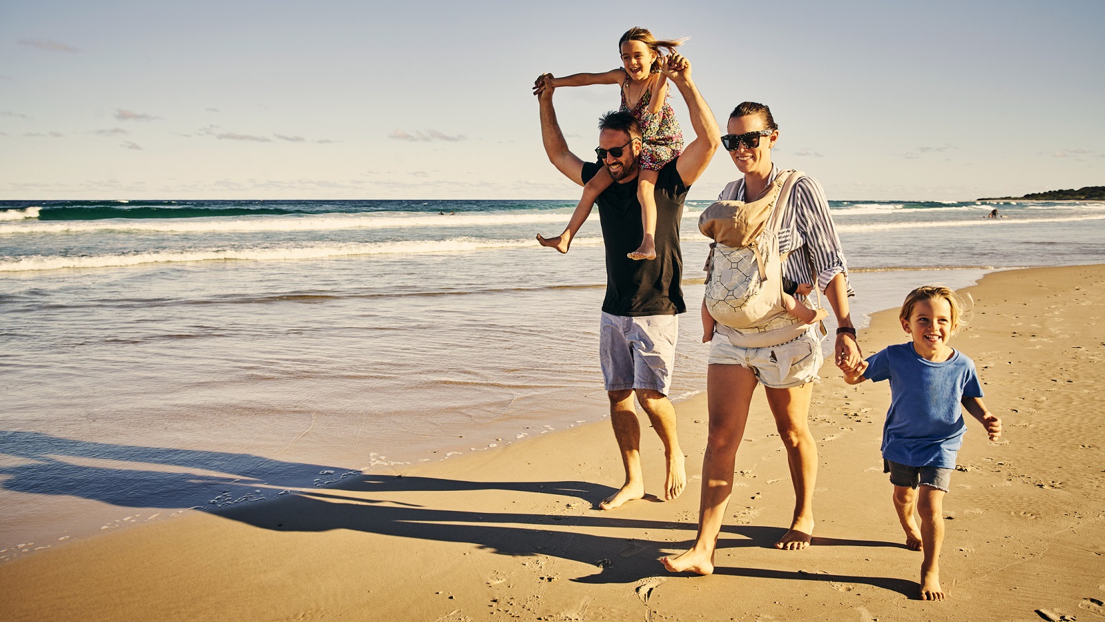 Shot of a happy family having fun at the beach